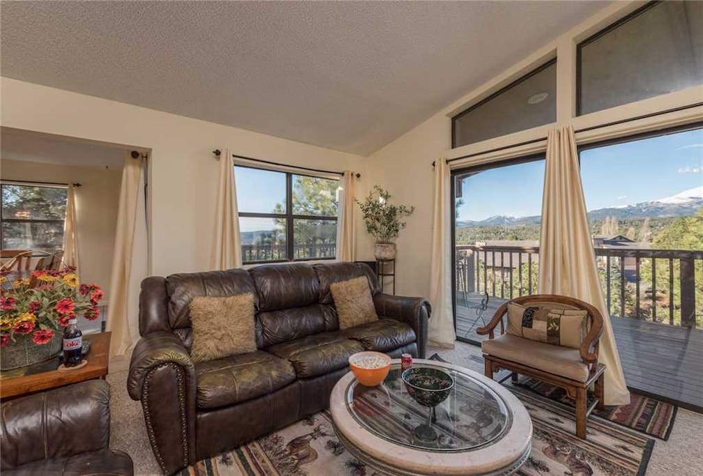 Easy Access - The living room provides quick and easy access to the outside deck where you can sit and enjoy the cool breeze and