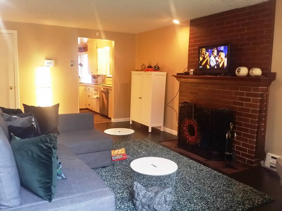 Fully furnished living room with Dish network cable with sports package, wireless internet, security system.