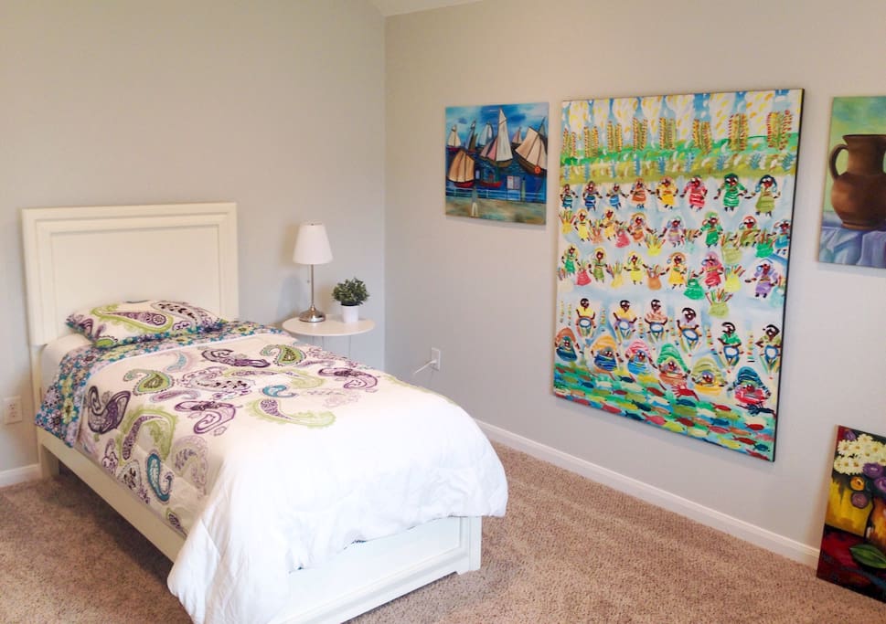 Comfortable single bed with my artwork!
