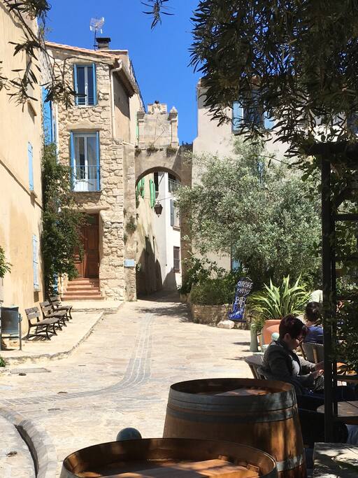 The main village square in Bages. Our house is the one in stone to the left of the arch and sundial