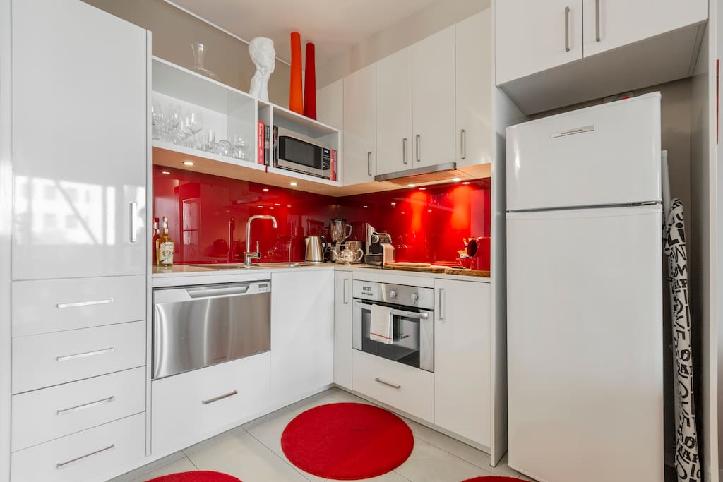 Sparkling clean kitchen with every appliance, and a stocked pantry and fridge
