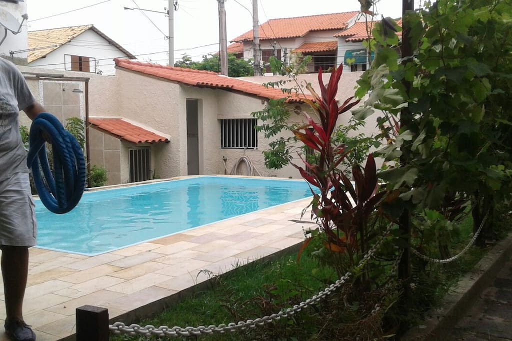 Pool view, with the outside bathroom and kennel at the background.