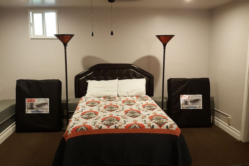Full bed accompanied by two roll away beds. We also have a couch available as shown in above photo.