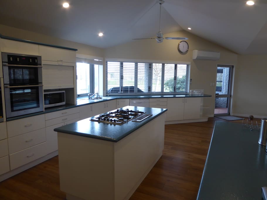3 wall ovens, 5 gas hobs, 2 fridge freezers