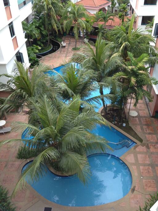 View of the pool from front door/walkway balcony