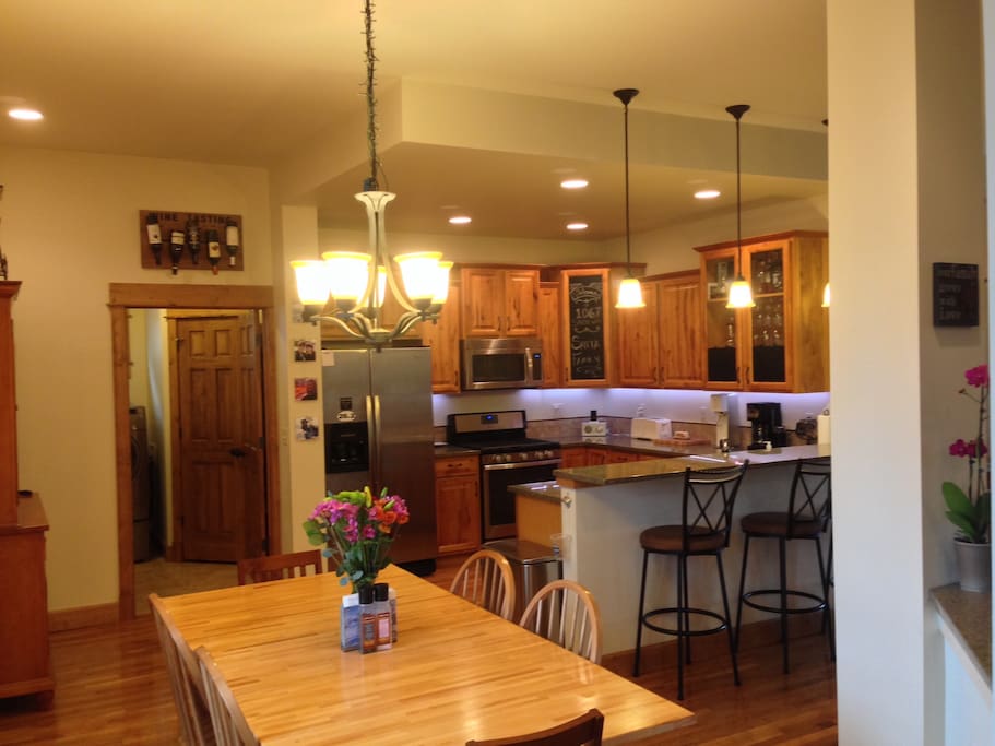 Open concept kitchen, dining and living room.