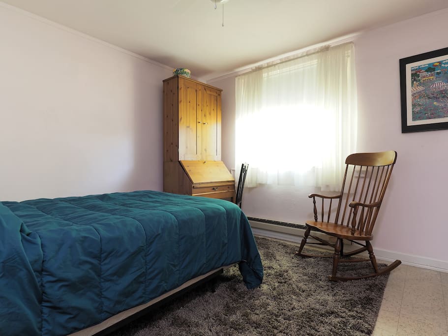 Bedroom & cupboard which opens into desk.
