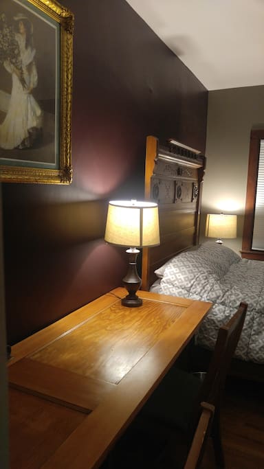 Large custom desk big enough for two. Made from antique door (original to house ) and black steel pipe with brass accents.