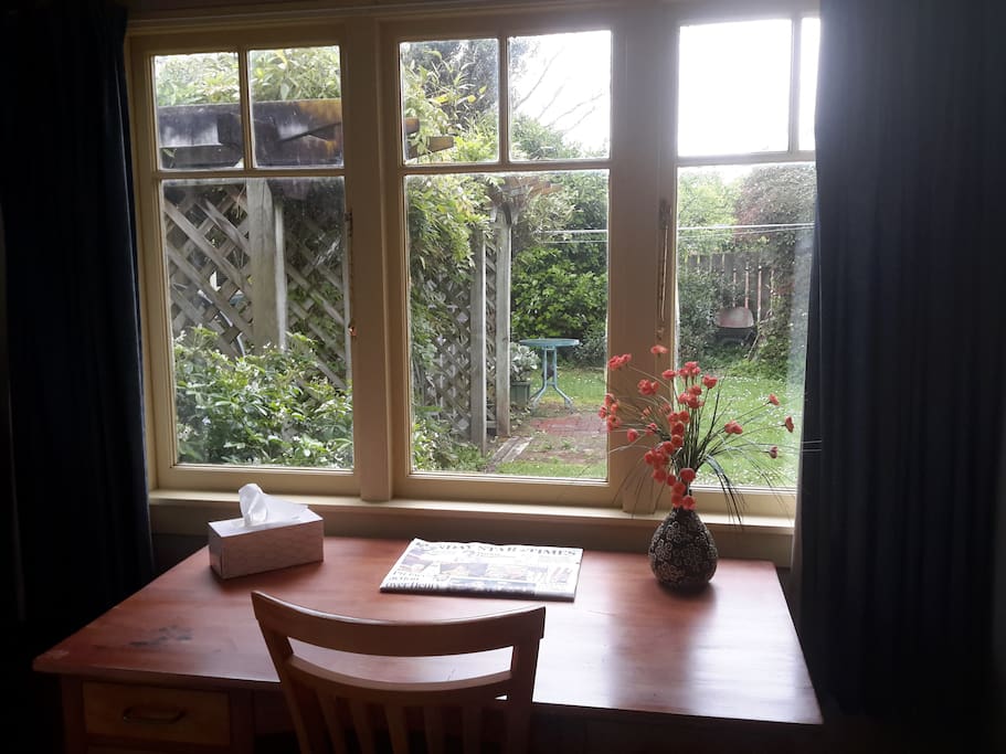 Window overlooks small garden, lovely suntrap, wooden lattice and climbing greenery provides privacy.