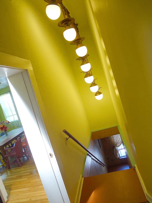 Sculptural light fixture in private entry stairwell
