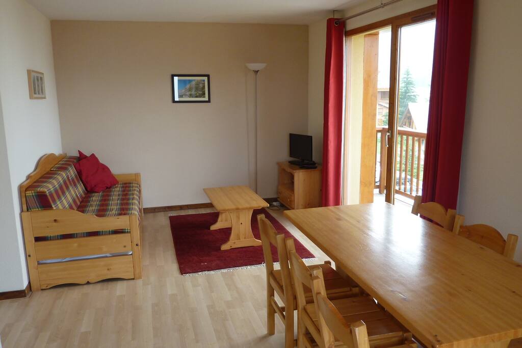 Dinner table with 6 chairs. Access to large balcony. Double sofa bed (or two singles)in lounge available.