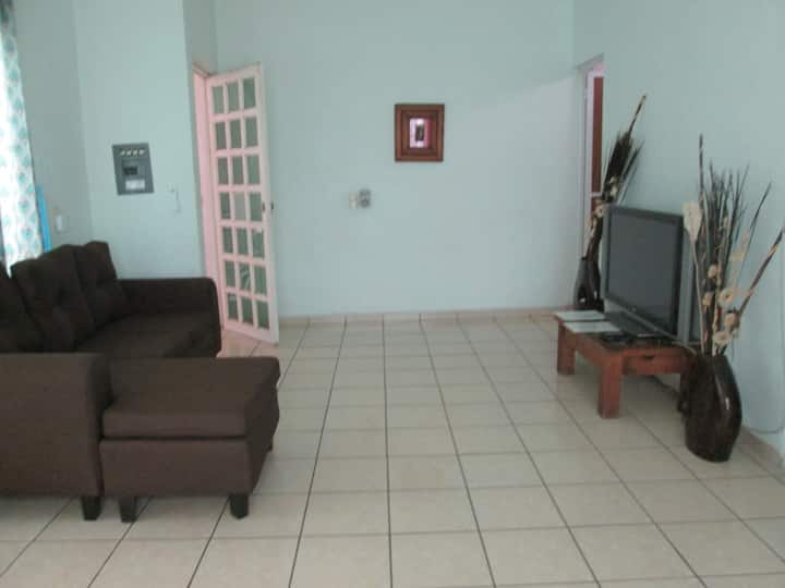 Living room view with new air conditioning and ceiling fan.