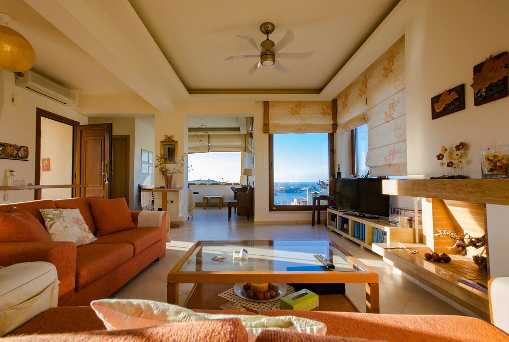 Indoor spacious living room with sea view
