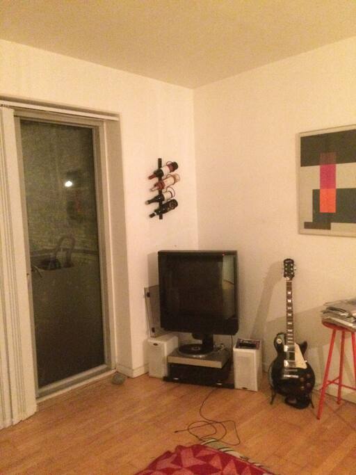 Livingroom full of music and cosiness. Door straight out to the balcony.