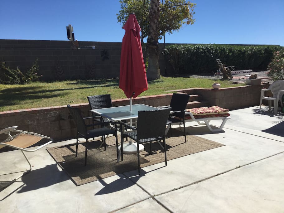 The patio in the back yard is a great place to lounge and relax.