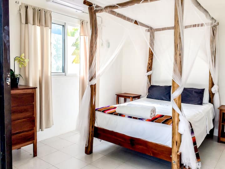 Bedroom 1 - 1 double bed and patio doors onto terrace overlooking beach