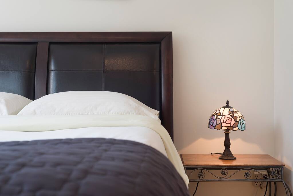 First bedroom with comfortable queen size bed