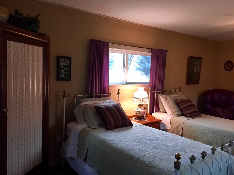 The bedroom and living space with antique furnishings.