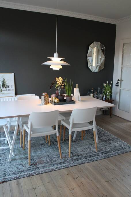 Dining area in open kitchen area, next to living room.