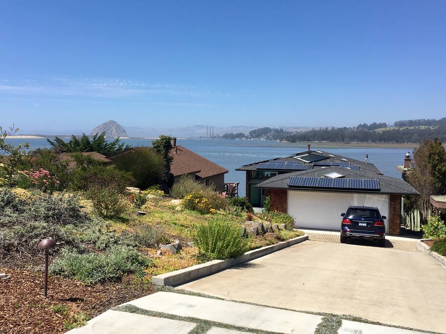 Street view of the driveway and garage that leads to the house entrance.