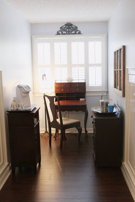 Alcove complete with writing desk and self-serve coffee/tea station