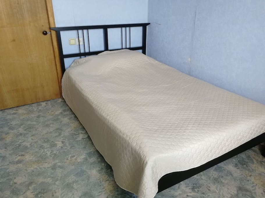 Separate room with one big bed, one table and a comfortable chair. Also the room is equipped with a dresser where you could place your clothes. The room has a separate exit to the balcony that gives you a picturesque view.