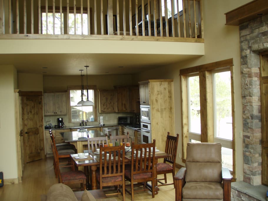 into the kitchen with view of upstairs loft