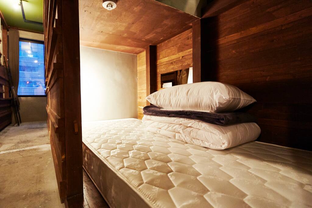 Inside of bed. All Beds are thick and comfortable. and have a light and socket.