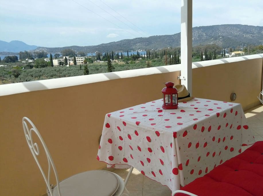 Balcony's view combines the blue color of Saronic golf and the green color of the famous Trizinian olive trees.