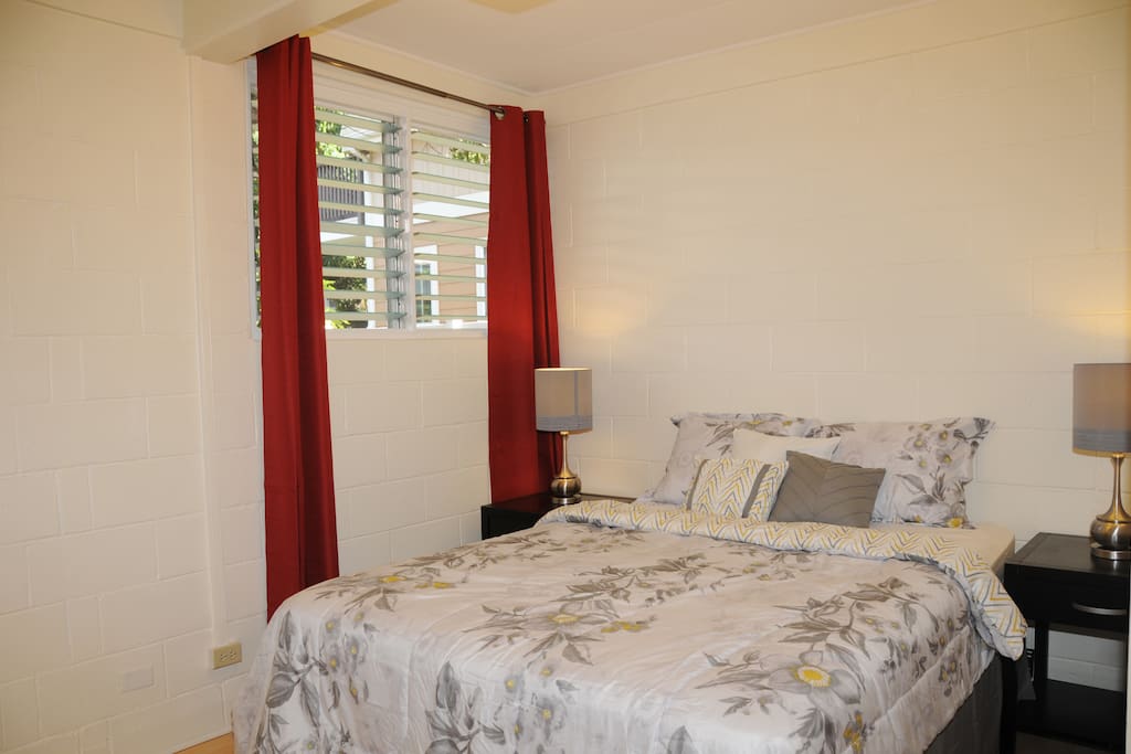Master bedroom queen size bed and ample closet space.