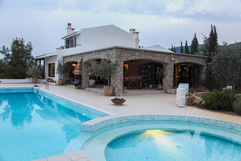 Infinity pool and front view of villa