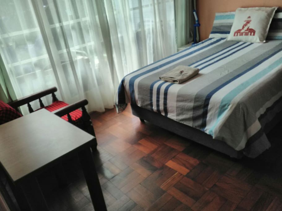 Lovely warm sunny room with double bed, sofa and table