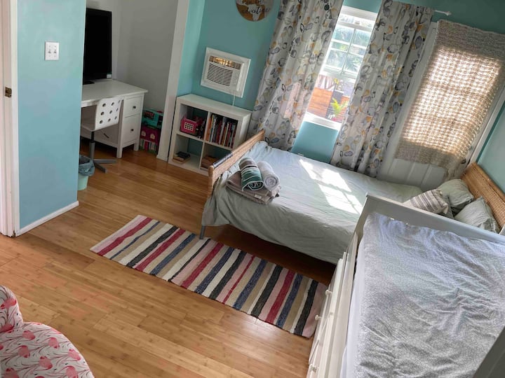 Bedroom 2 upstairs
Can slip up to 4 
One queen size bed, and two single beds. 
There is some toys for kids