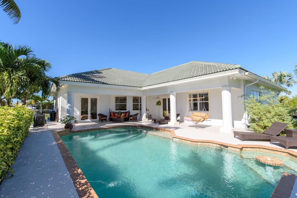 Rear of house, with large patio, and heated pool