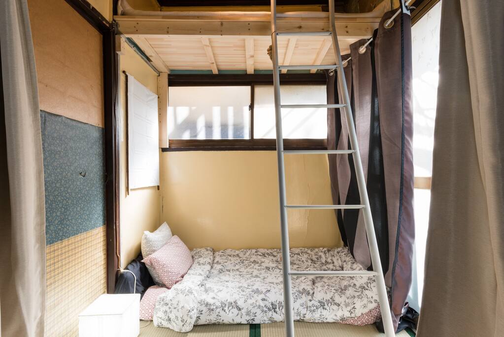 One attic bed and one futon below (or can put two futons side by side below and use attic bed for storage)
