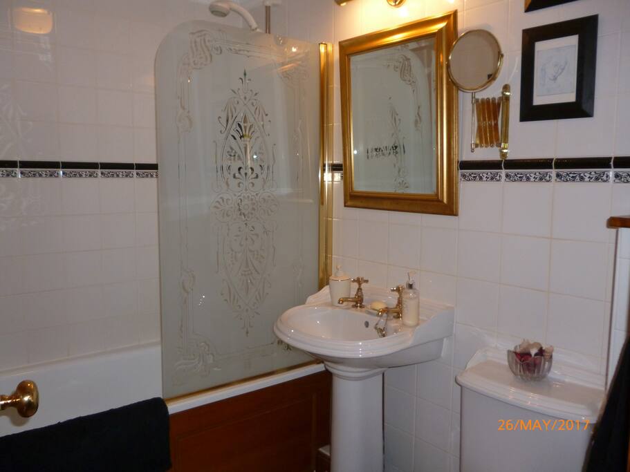 Downstairs bathroom with bath and shower