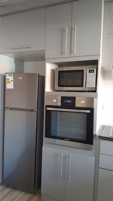 Each apartment has appliances and kitchen utensils