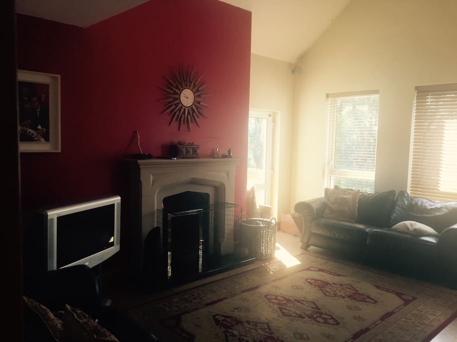 The spacious sitting room with open fire