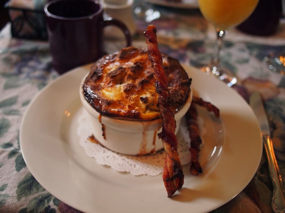 French Toast Souffle' with twisty bacon. Another house specialty.