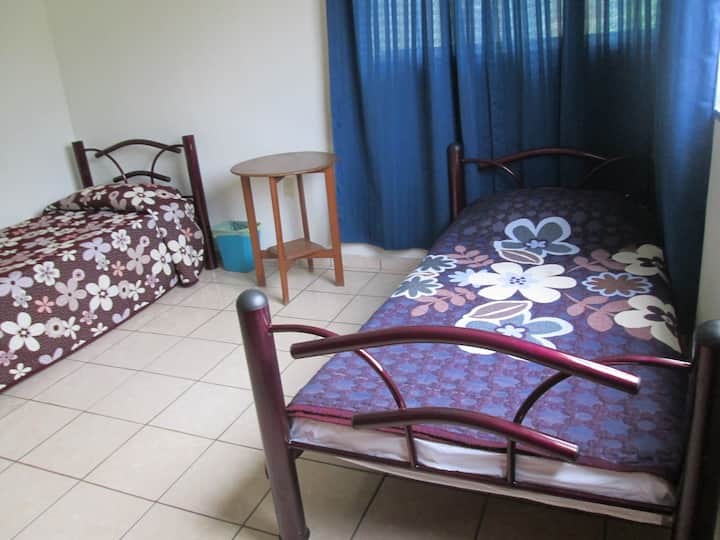 bedroom with A/C and 2 single beds