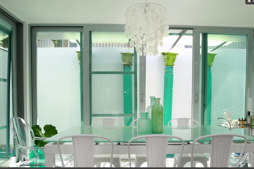Dining area overlooking the pool. Seats 8.