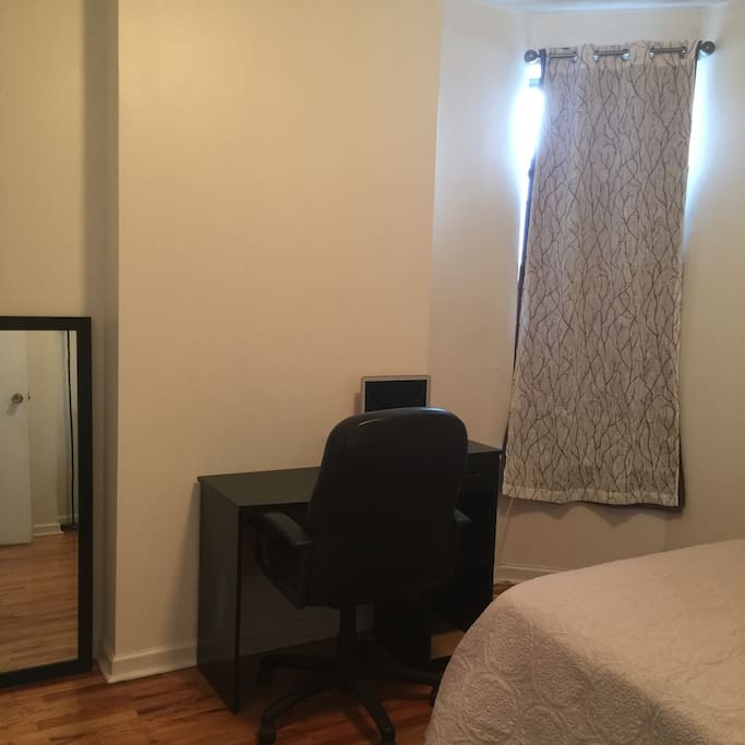 Desk table and office chair and a good size closet.