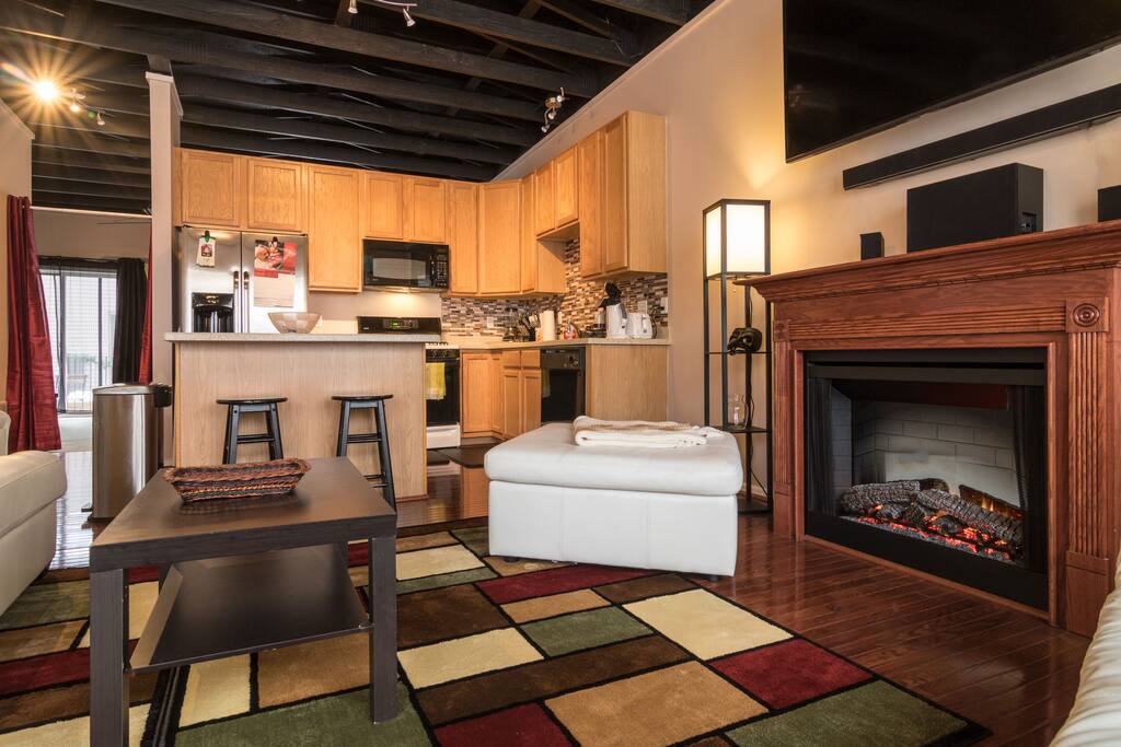 View from the front windows towards the open style kitchen area of the loft space.