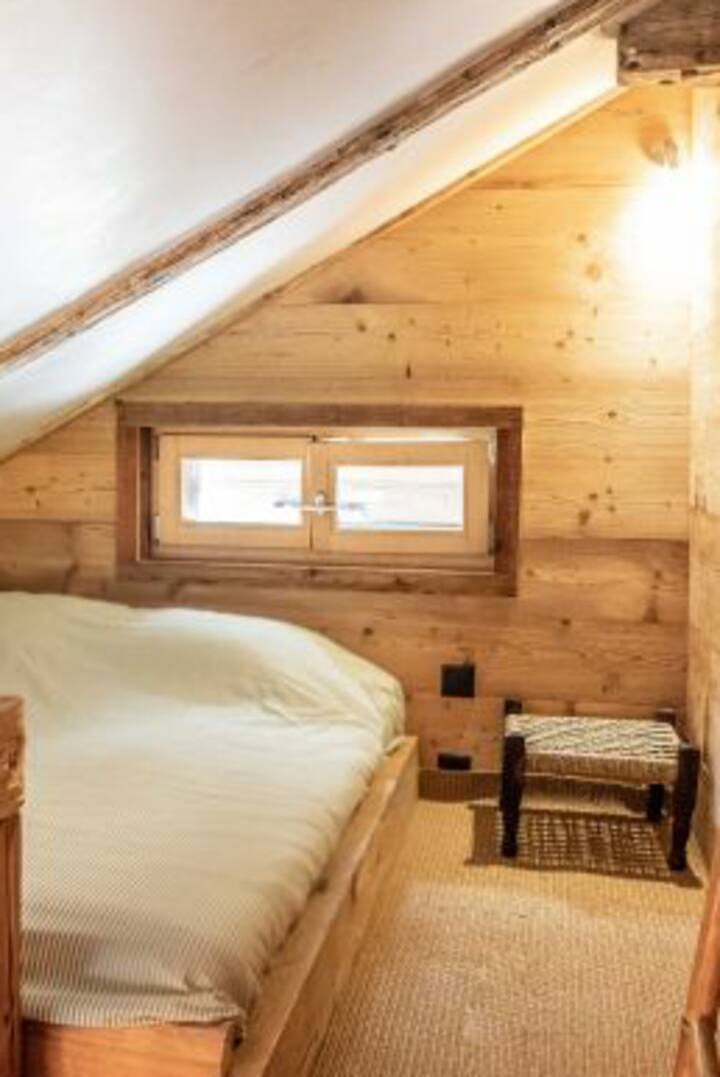 Cosy double bed for two in the mezzanine.
