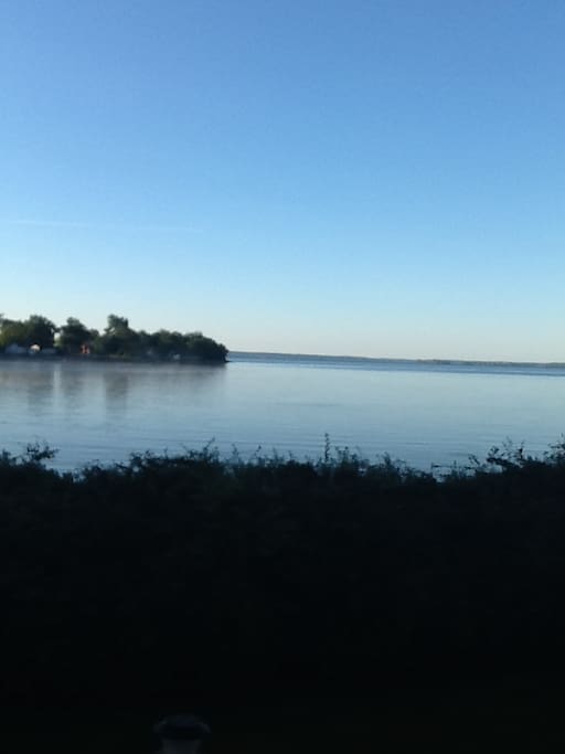 Lakefront view from kitchen window at dusk.