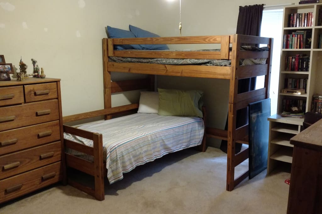 Bedroom #1 with two bunk beds, plus desk and dressers.