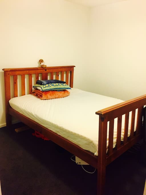 Bedroom with a queen size bed & wardrobe