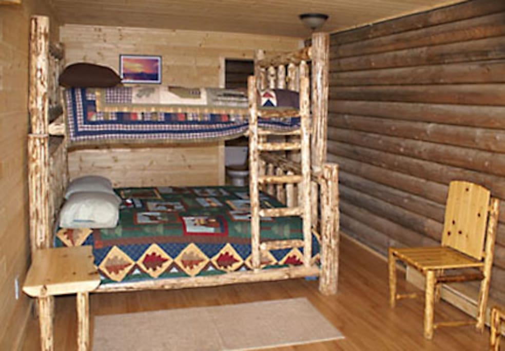 The 'Augustine Room' is appointed with Ken's handcrafted log furniture, comfortable mattresses and cozy bedding