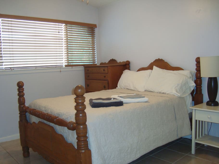 Bedroom #2 - Full size bed, dresser, night stand with lamp, and closet. Window along 1 wall - looks onto the back yard and gets a few hours of direct sunlight in the afternoon.