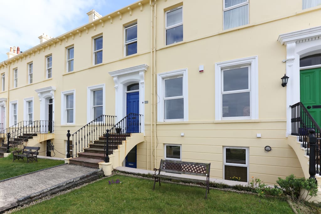 The apartment is on the ground floor of this 3 storey Victorian terrace.